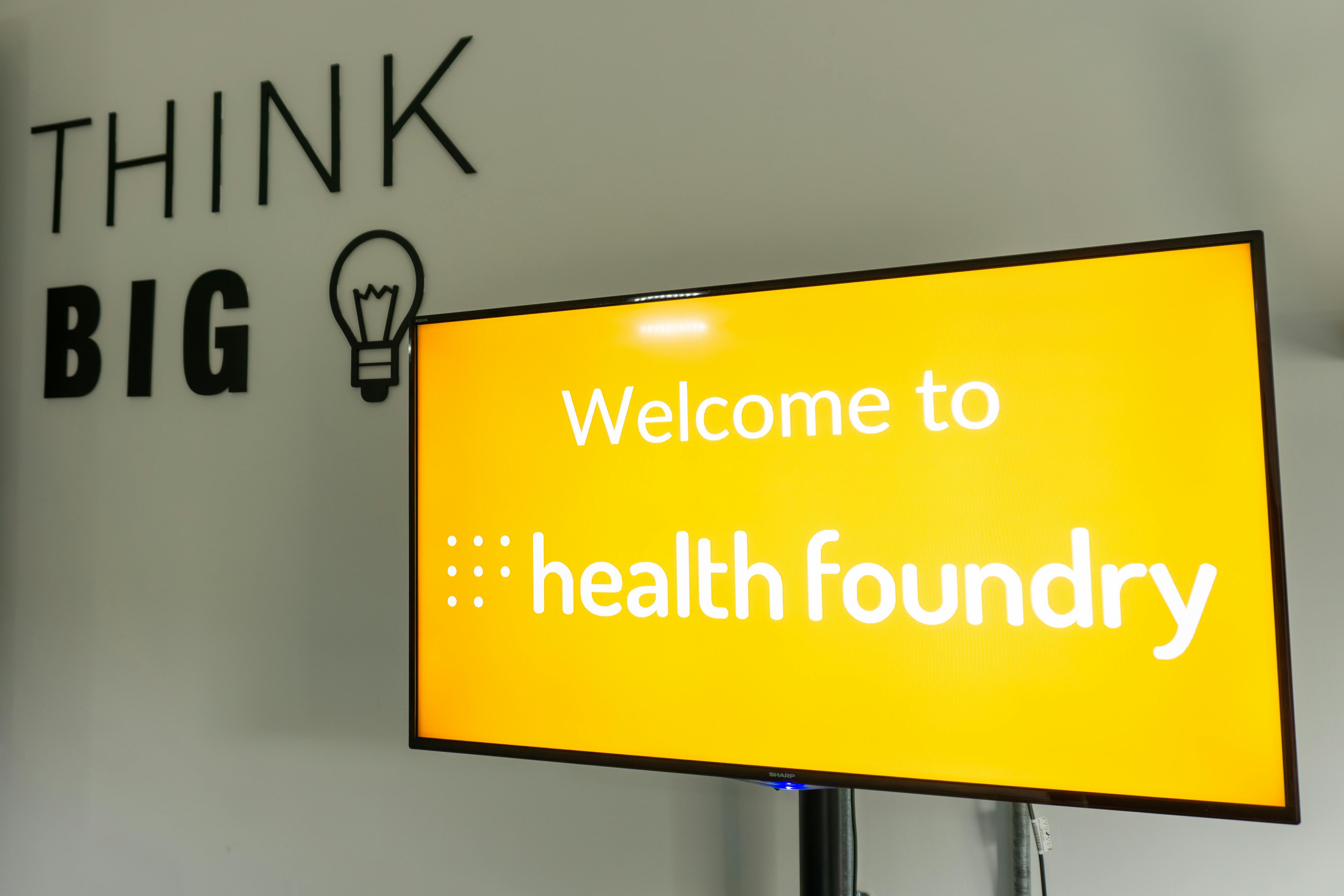 Medium Meeting Room at Health Foundry with "THINK BIG" display for innovative events.