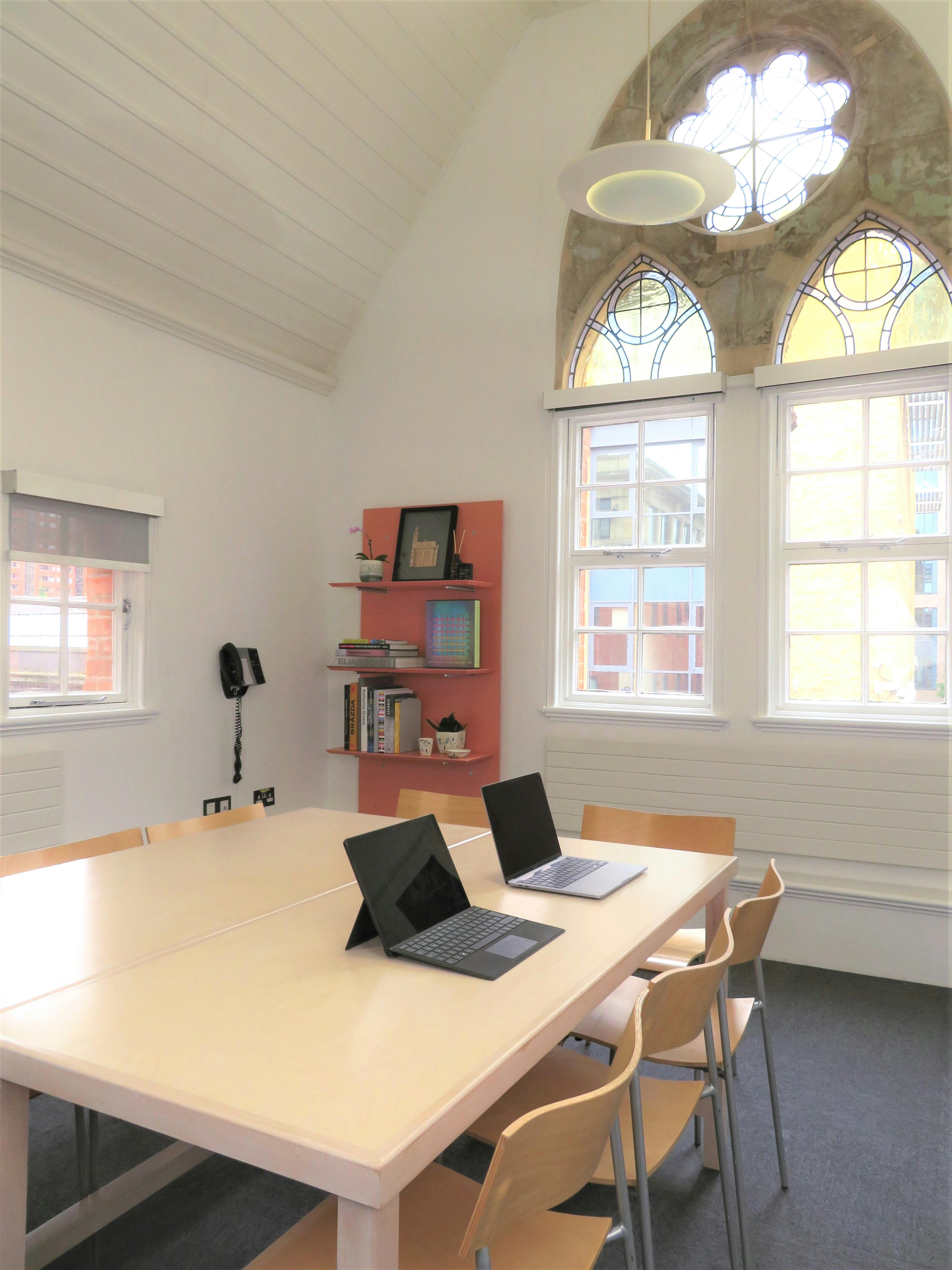 Modern meeting room at Ikon Gallery, bright with natural light for collaborative sessions.