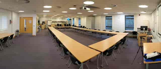 Versatile teaching room with U-shaped table for workshops at National STEM Learning Centre.