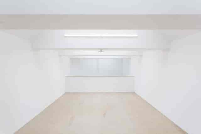 Versatile minimalist event space with natural light for workshops and meetings at Mimosa House.