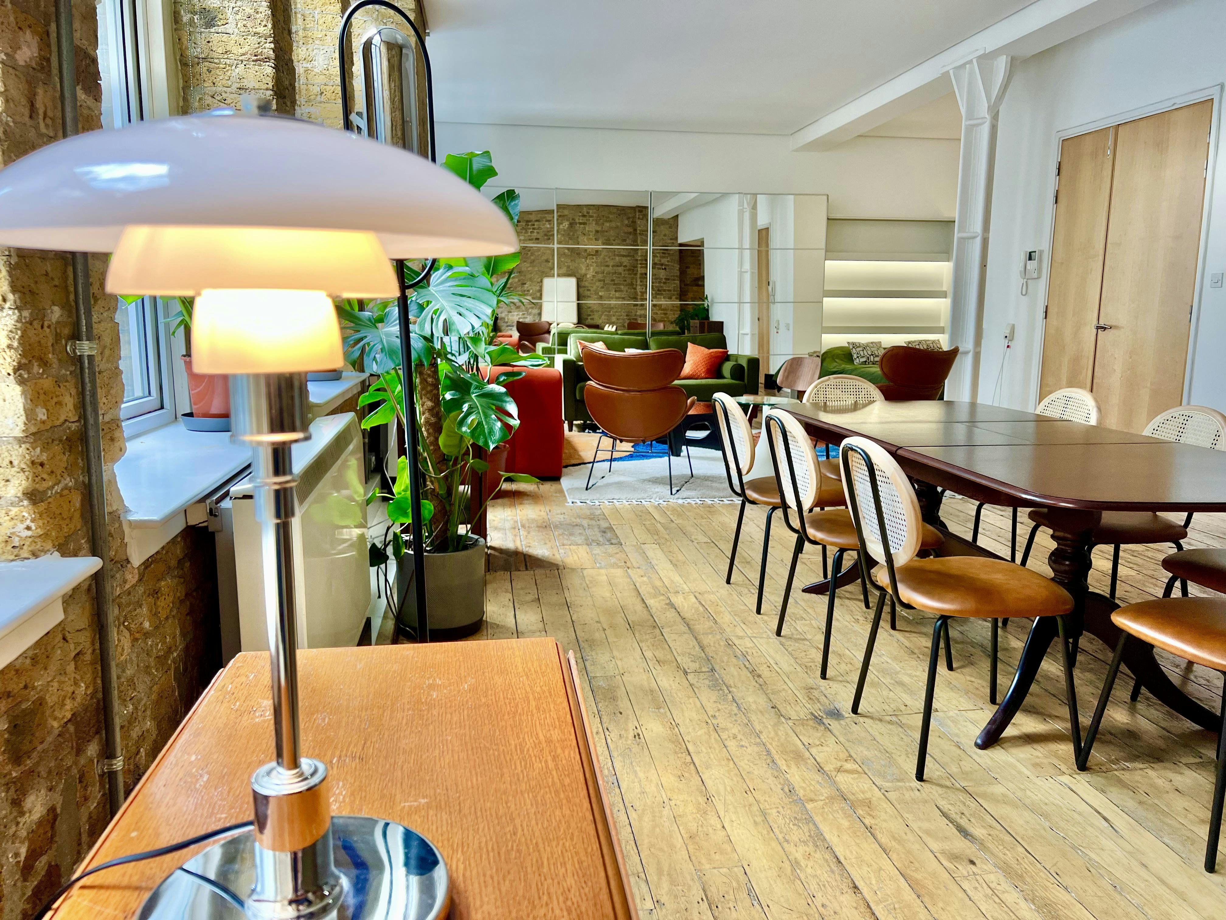 Inviting meeting space in The Artist's Loft, Shoreditch with modern vintage decor.