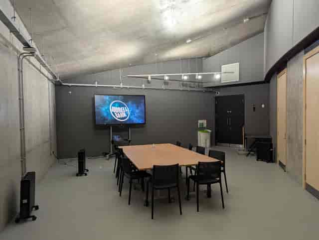 Modern meeting room with large table, ideal for conferences and brainstorming at Jodrell Bank.