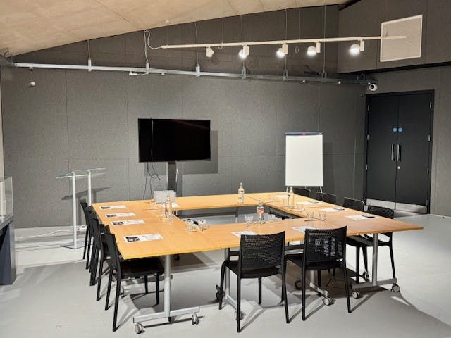 Modern meeting room at Jodrell Bank, featuring a large screen for professional events.