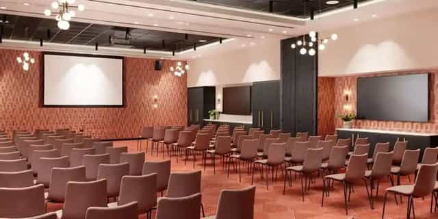 Modern event space at The Theatre in Malmaison York with dual screens for presentations.