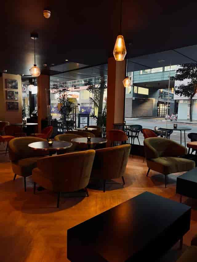 Stylish modern venue with cozy seating for intimate meetings and networking events.