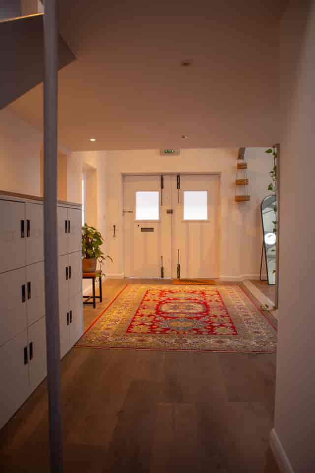 Welcoming entrance of The Space London with stylish rug, ideal for meetings and events.