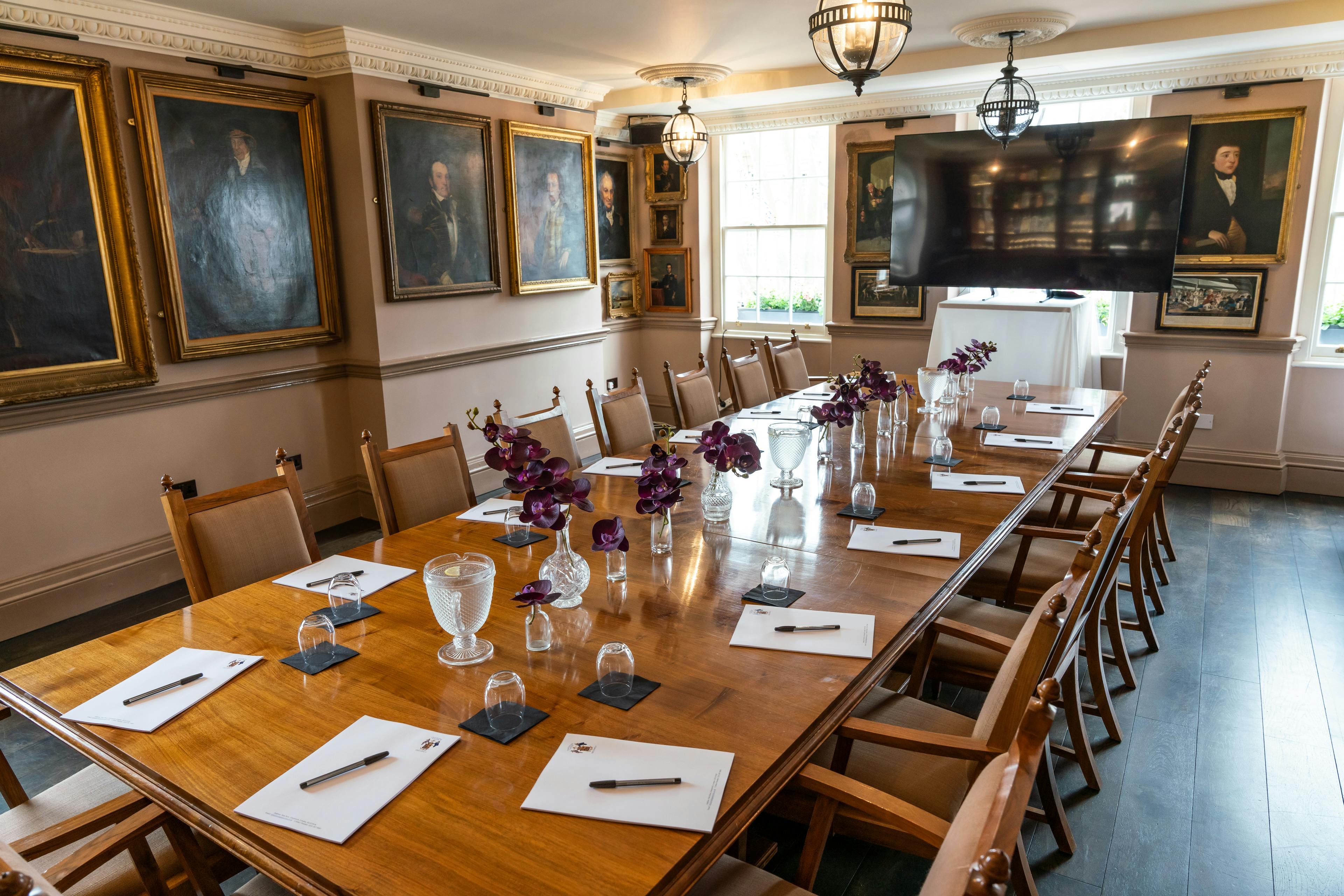 Pickle Room at Trafalgar Tavern: elegant meeting space with wooden table, ideal for conferences.