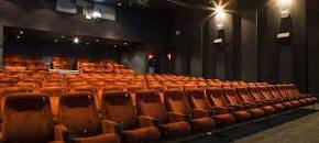 Modern Exeter Picturehouse theater with plush orange seating for film screenings.