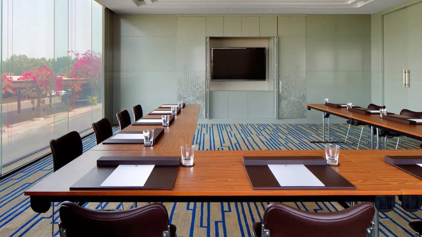 Modern meeting room in Hyatt Regency Dubai, featuring a large table for professional events.