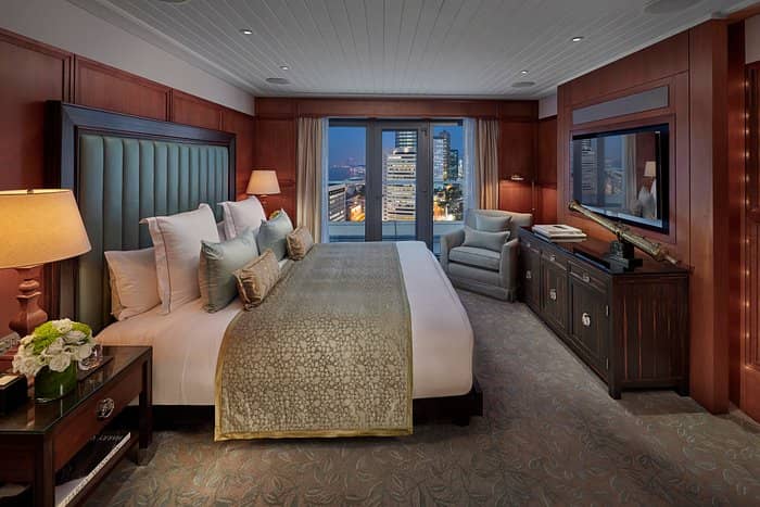Luxurious Mandarin Oriental Hotel room with plush bedding, ideal for VIP events.
