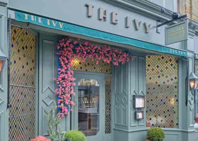 Elegant Ivy Harrogate restaurant exterior with vibrant flowers, perfect for events and dining.