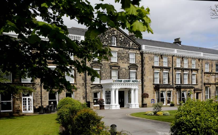 Harrogate Town Suite at Cedar Court Hotel, classic stone facade for corporate events.