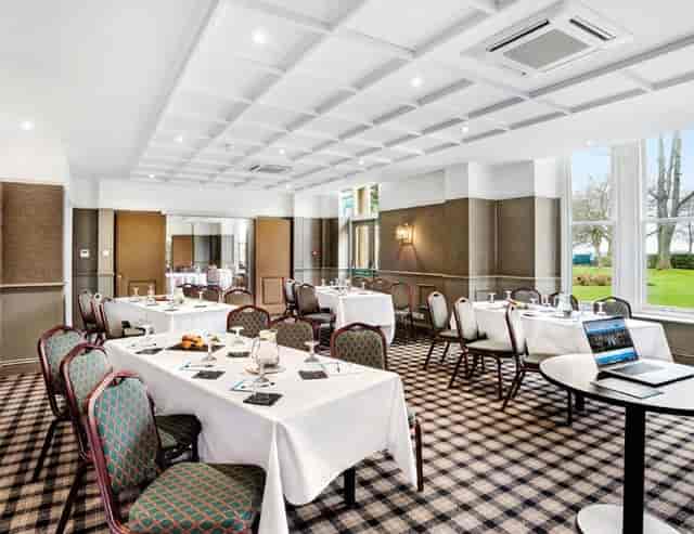 Harrogate Town Suite meeting room with elegant seating for corporate events and workshops.