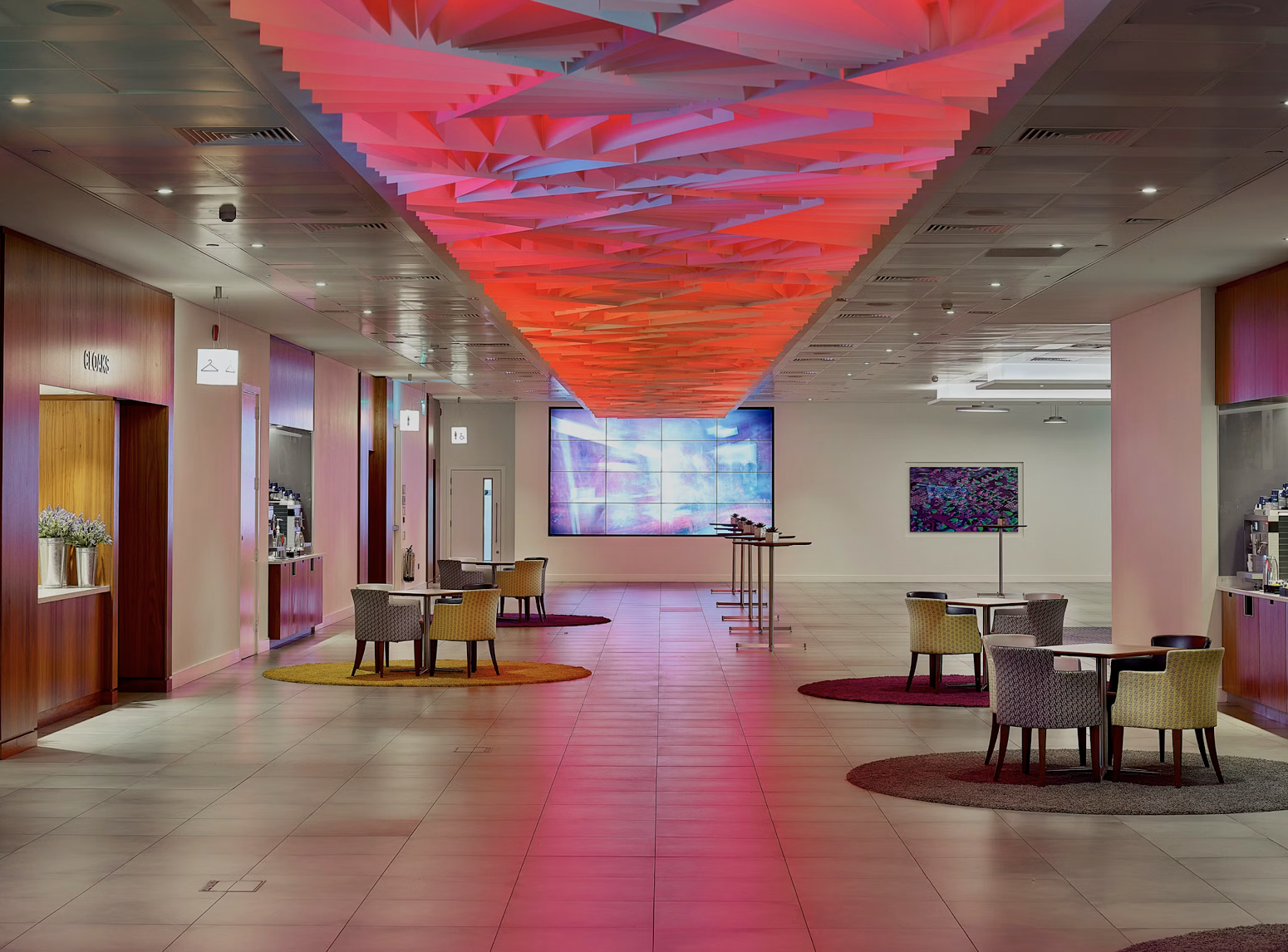 Modern event space with vibrant ceiling at Broadgate Suite, ideal for corporate gatherings. - Banner