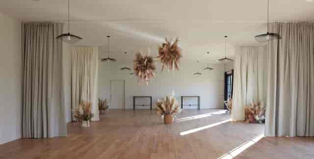 Elegant event space with floral decor, perfect for intimate gatherings and workshops.