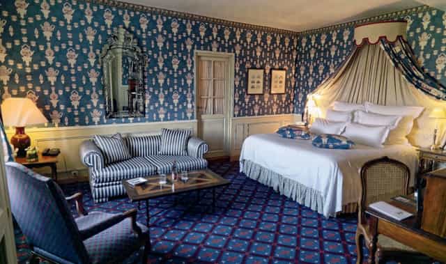 Elegant hotel room in Château de Courcelles, perfect for intimate meetings and retreats.