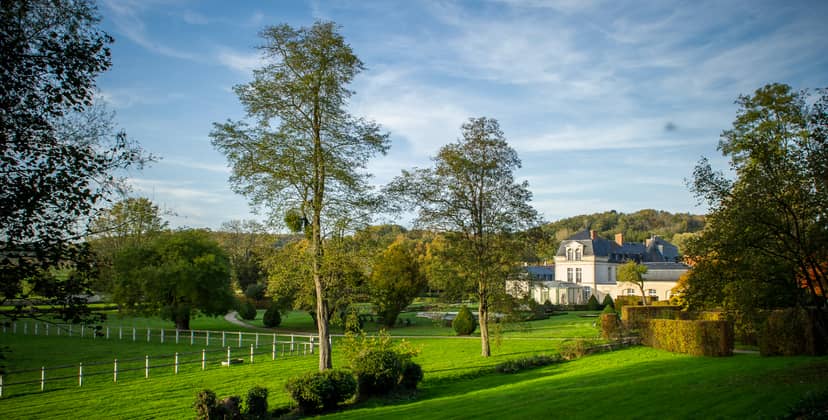 Château de Courcelles library, lush greenery venue for outdoor events and receptions.