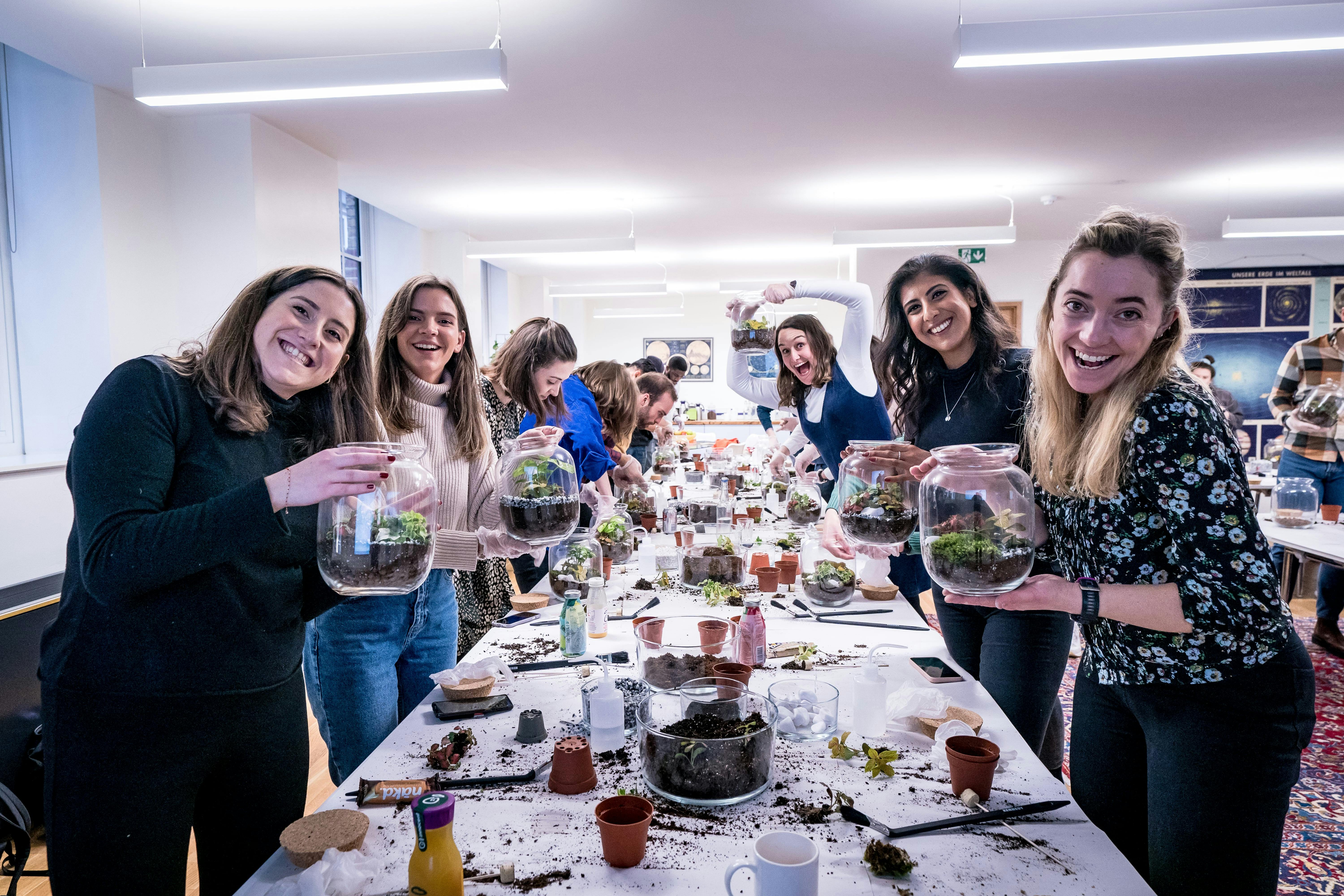 Team-building event at Wallacespace with participants creating terrariums.