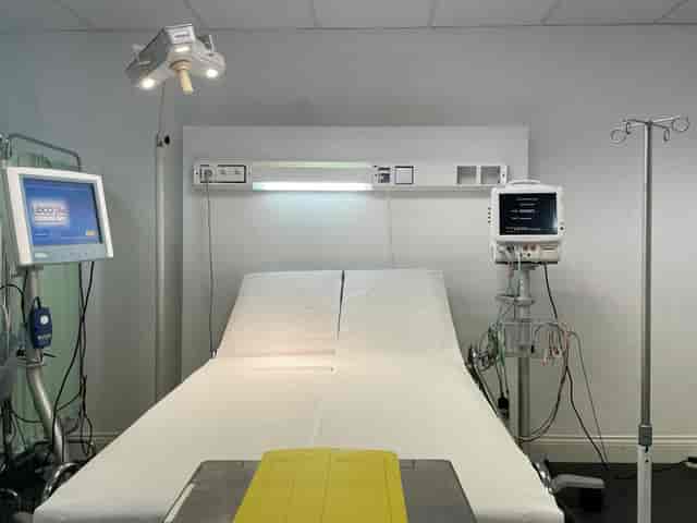 Medical hospital room with examination bed for health conferences and workshops.
