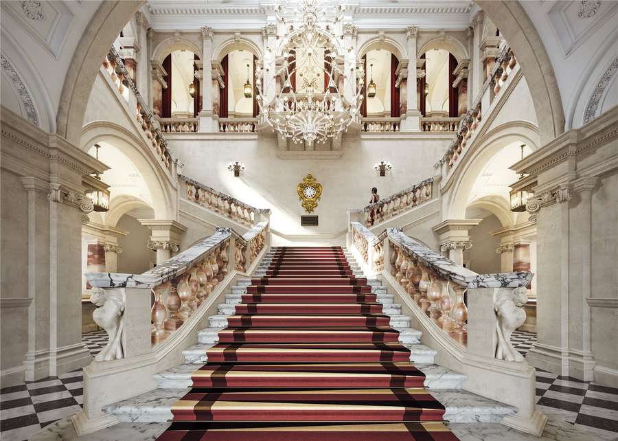 Grand staircase in Raffles OWO, ideal for elegant galas and corporate events. - Banner