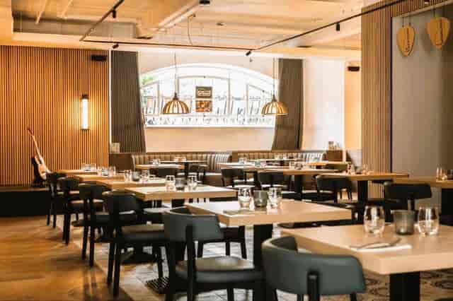Modern Strings Restaurant with flexible seating for corporate events and social gatherings.