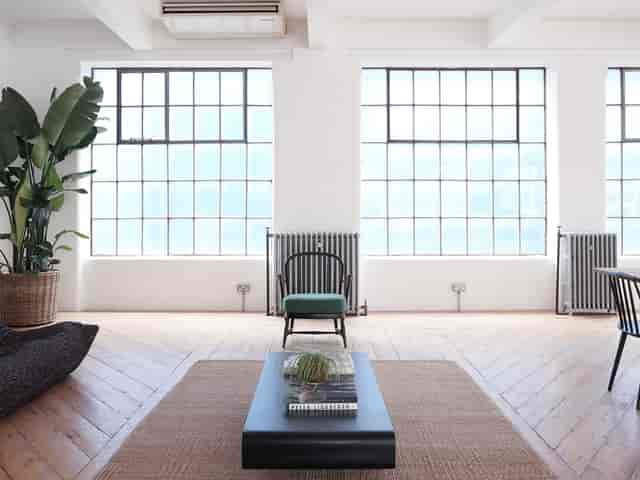 Studio 2 industrial VIP meeting room with floor-to-ceiling windows for creative workshops.