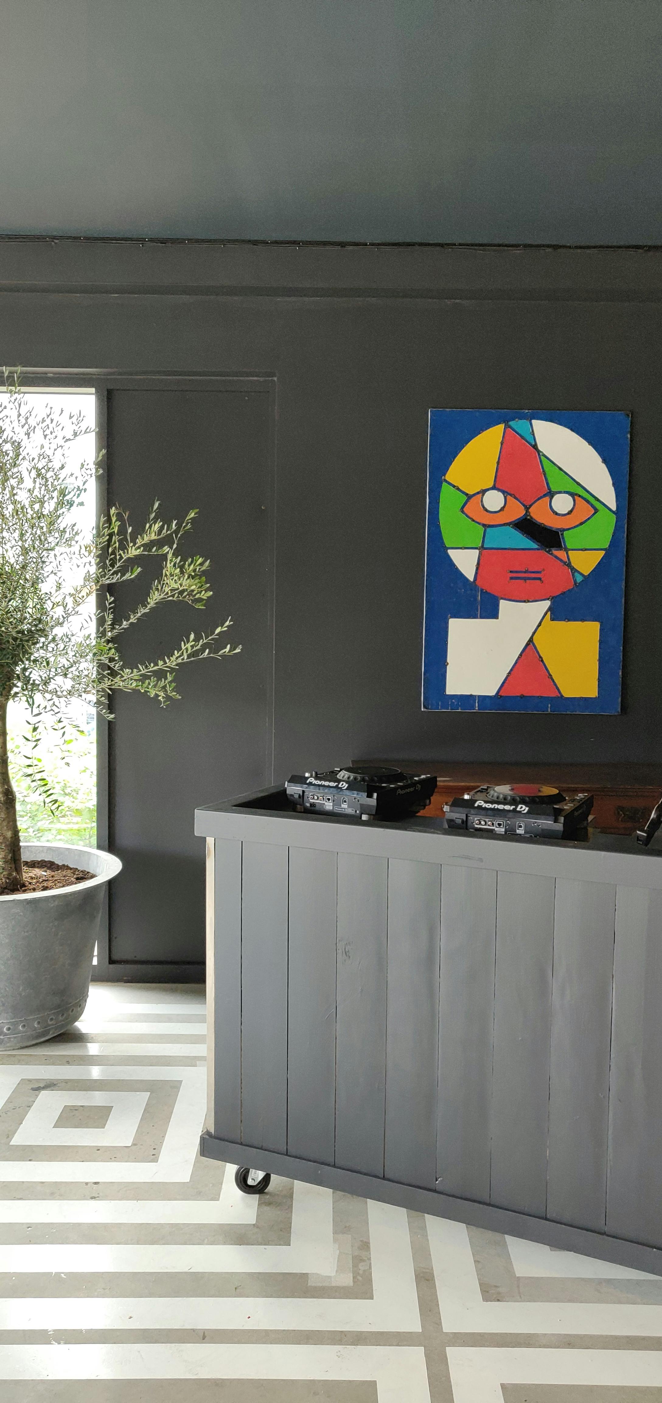 Nico's Bar in Hackney Bridge: modern event space with DJ setup and vibrant artwork.