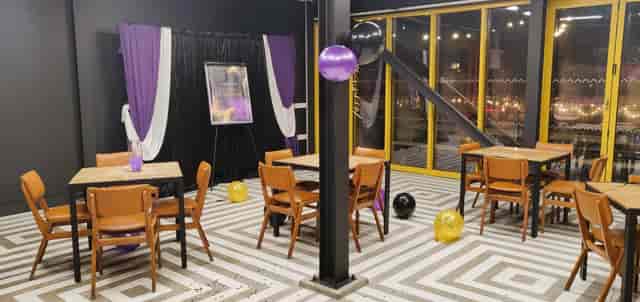 Stylish event space in Hackney Bridge with striped floor, ideal for meetings and celebrations.