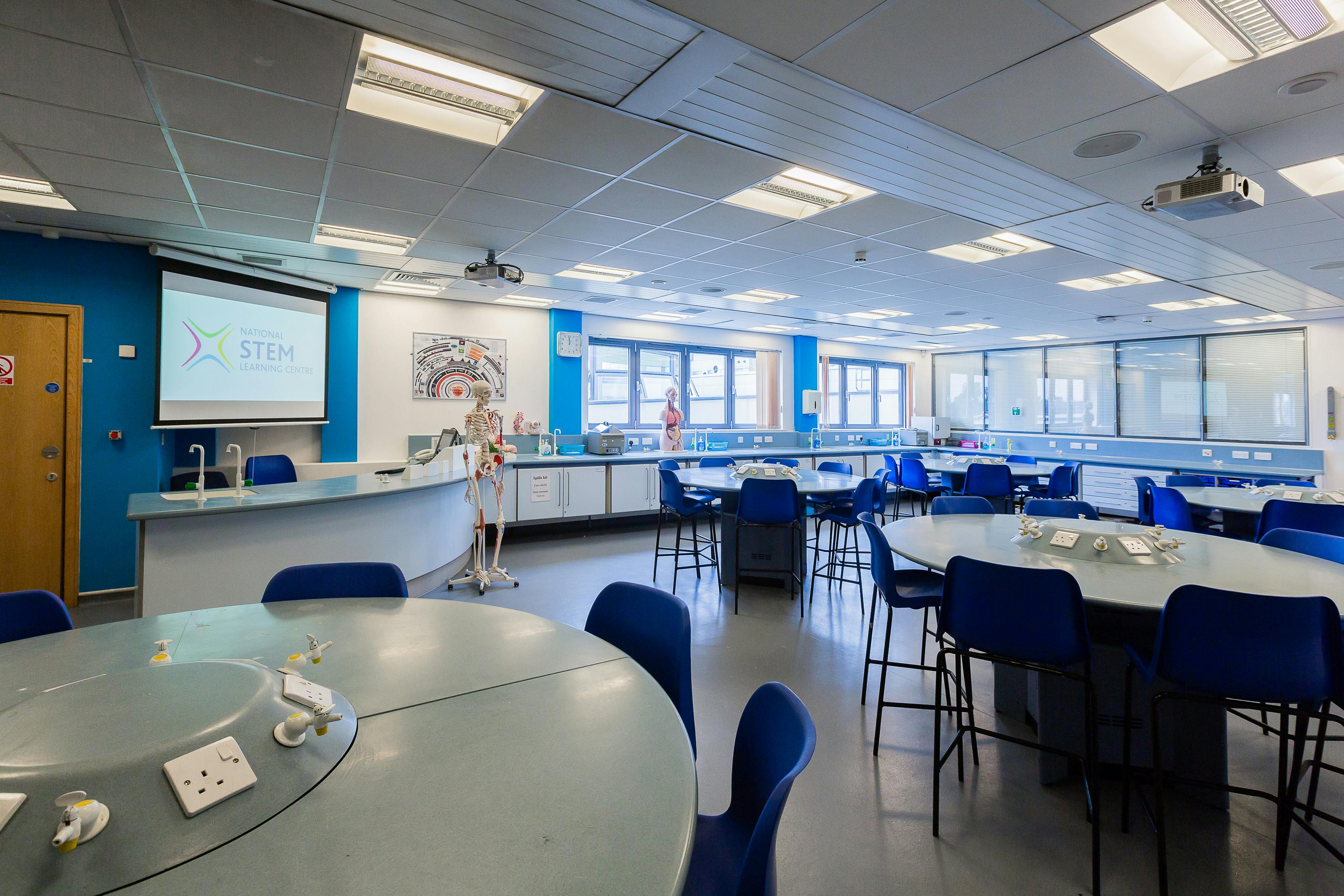 Interactive STEM learning lab with circular tables, ideal for workshops and training events.