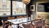 Modern meeting room in Radisson Collection Copenhagen with sleek table and natural light.