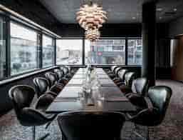 Modern conference room with sleek table and stylish chairs in Radisson Collection Copenhagen.
