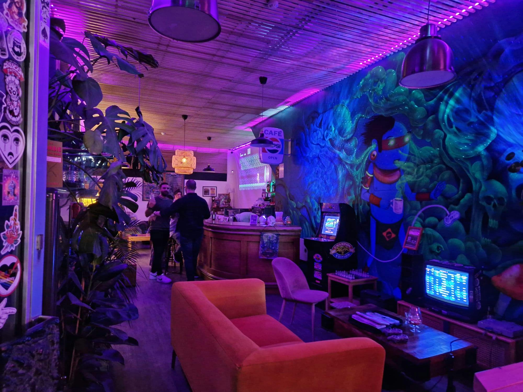 Vibrant Zombie Games Cafe with colorful mural, ideal for creative events and gatherings.