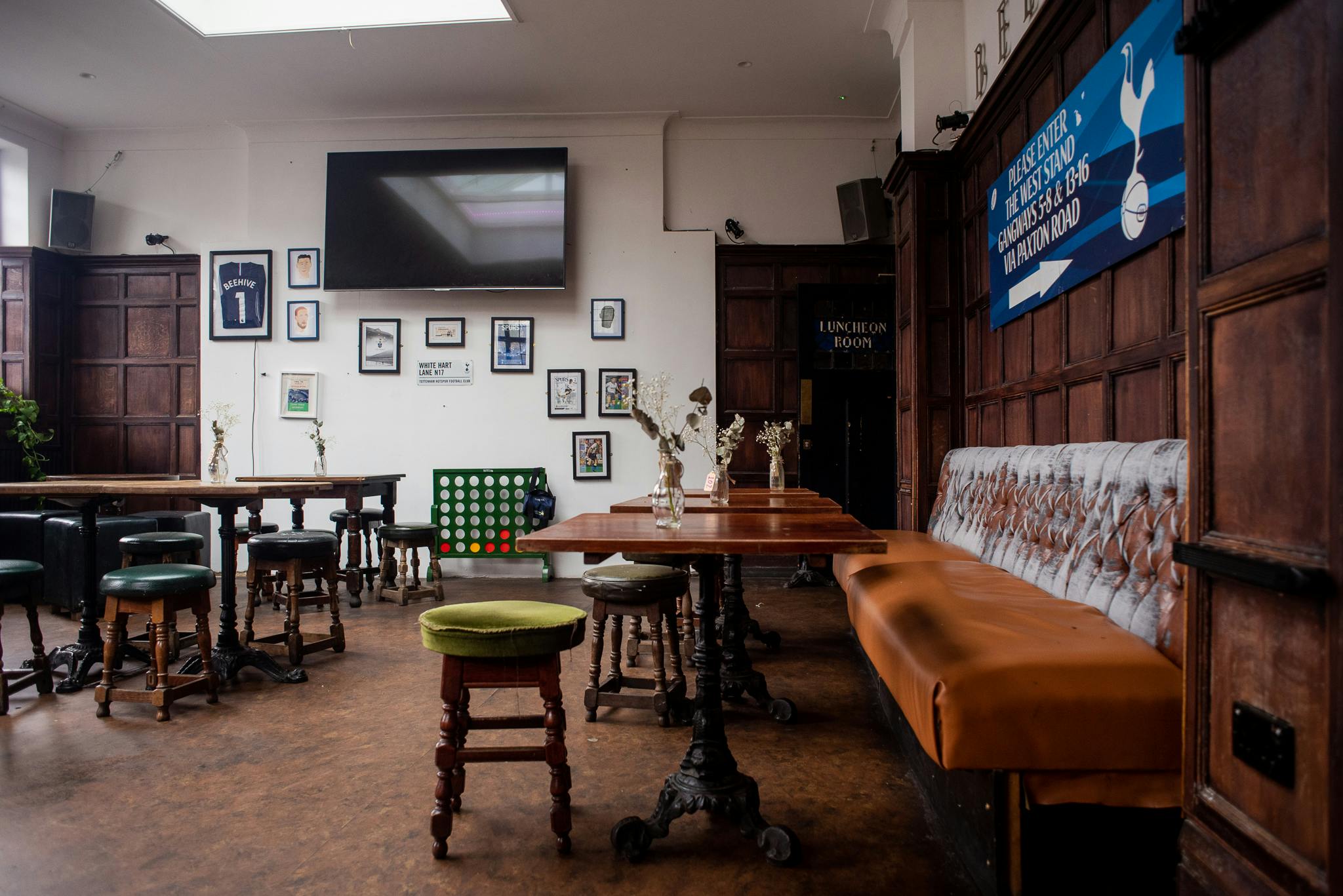 Games Room in Beehive: cozy event space with wooden paneling for gatherings and presentations.