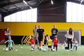 Indoor soccer training at Profootball Arena, ideal for family events and team-building activities.