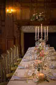 Elegant dining table with floral centerpiece for formal events at Kingswood Arts.