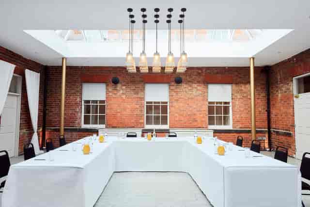 Winstanley House meeting space with U-shaped table, ideal for workshops and planning sessions.