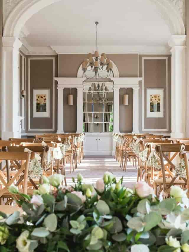 Elegant event space at Hothorpe Hall with floral centerpieces for gatherings.