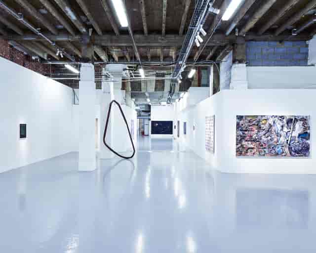 Modern gallery with white walls, perfect for art exhibitions and corporate events.