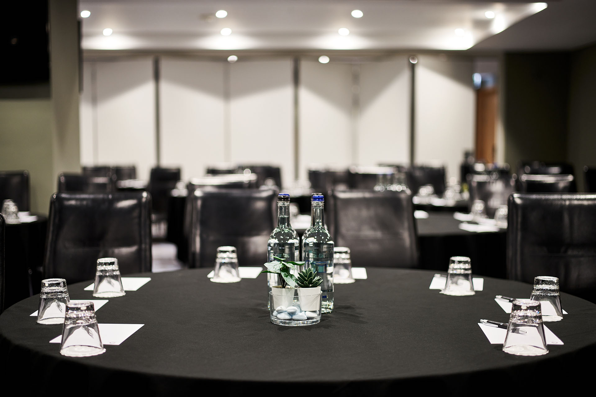 Meeting room at The Cumberland Hotel with round tables, ideal for professional gatherings.