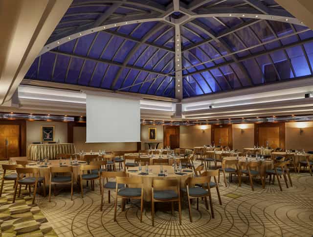 Crystal Ballroom in Alamac X Prague with round tables, ideal for corporate events and gatherings.