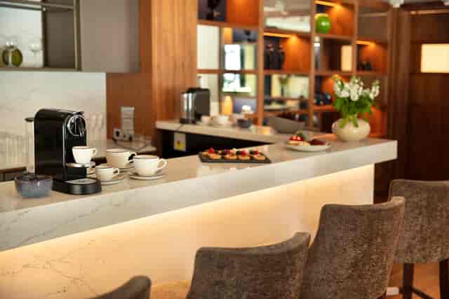 Crescent Suite refreshment area with marble countertop for meetings and events.