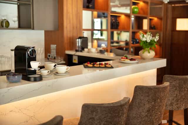 Crescent Suite refreshment area with marble countertop for networking events