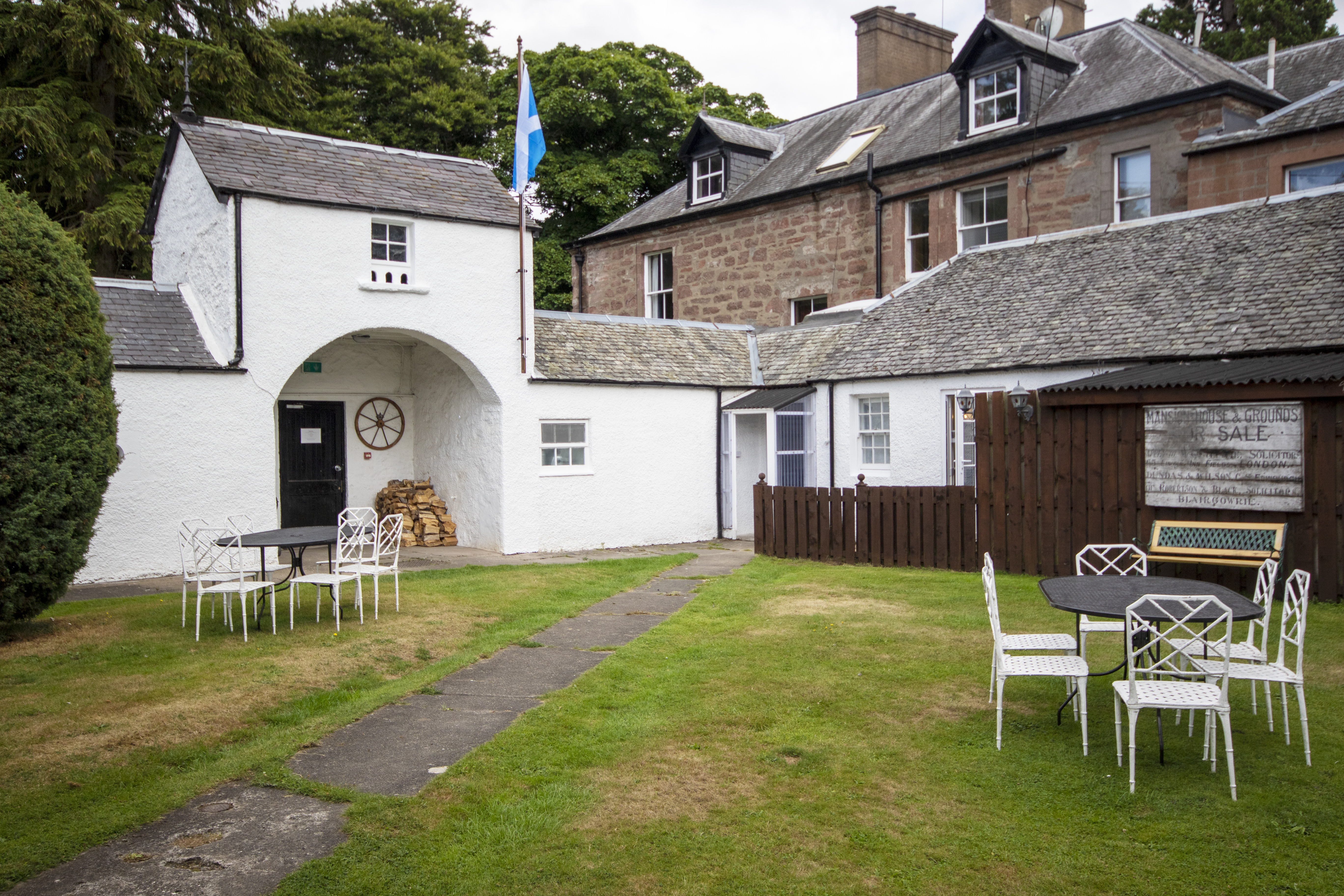 Charming outdoor event space at McArthur Manor with rustic architecture for gatherings.
