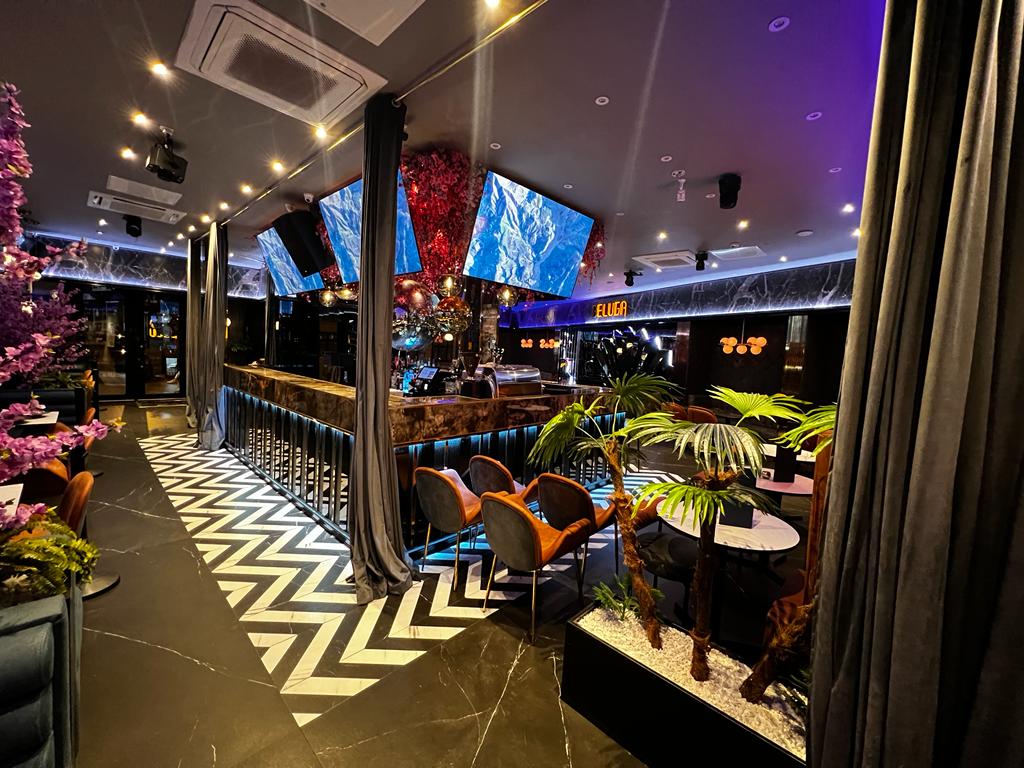 Vibrant event space at Pizza Loca with modern decor, ideal for gatherings and networking.