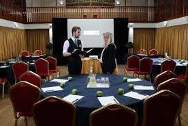 Trafalgar Ballroom at Royal Maritime Hotel, elegant meeting space with round tables.