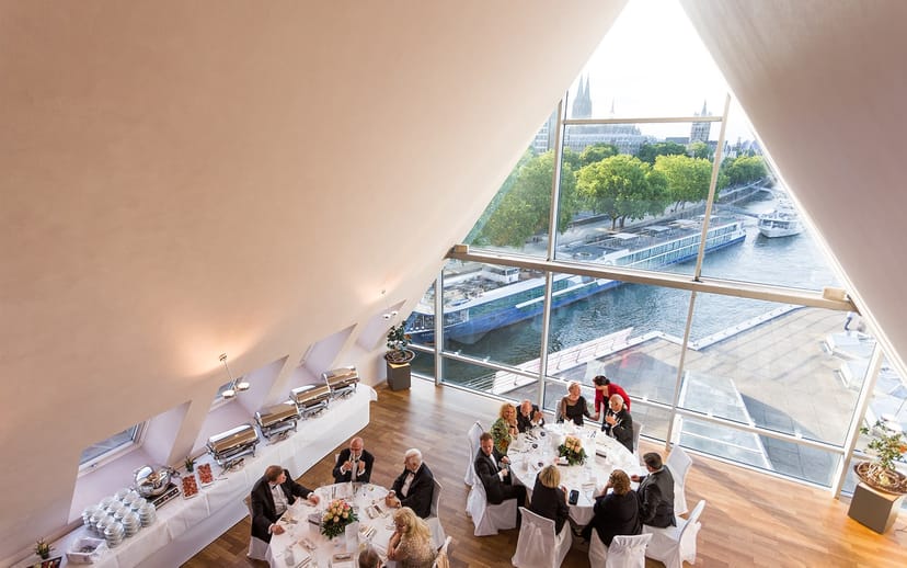 Elegant event setup at Bel Etage, Schokoladen Museum with city view and networking ambiance.