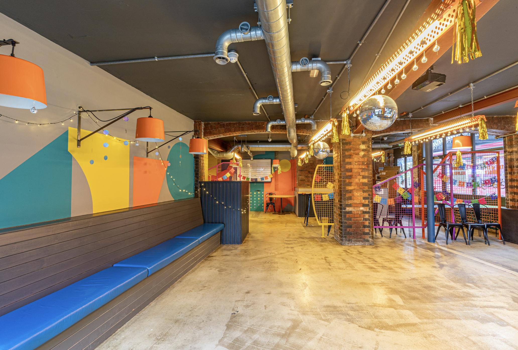 Vibrant Medley Market event space with colorful art, ideal for networking and parties.