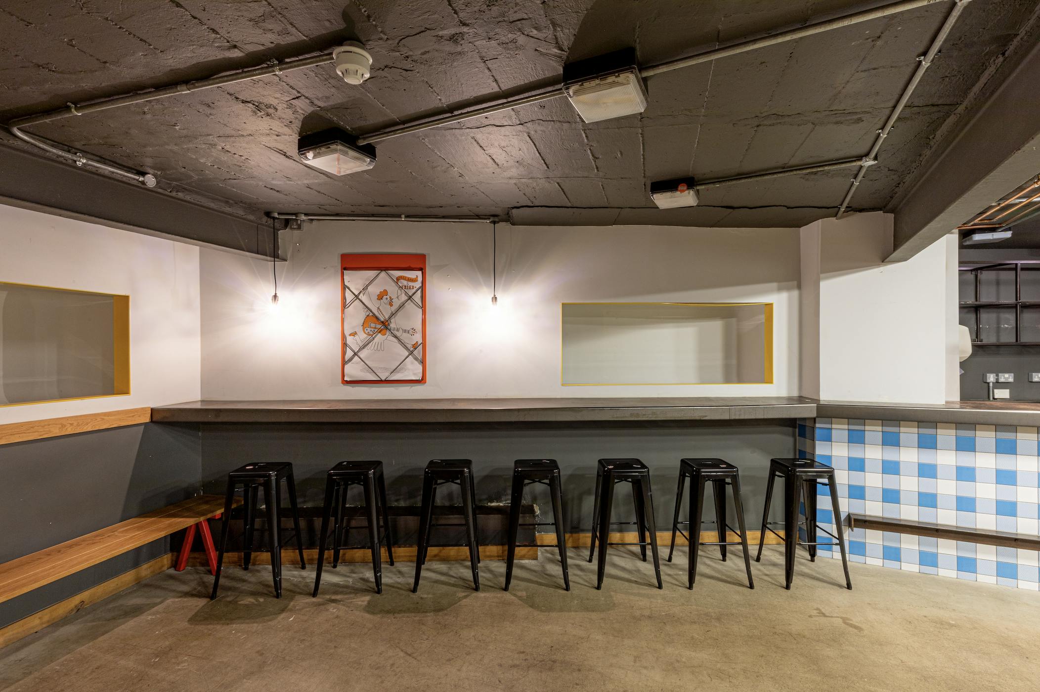 Versatile event space with sleek bar, ideal for gatherings and networking in Medley Market.