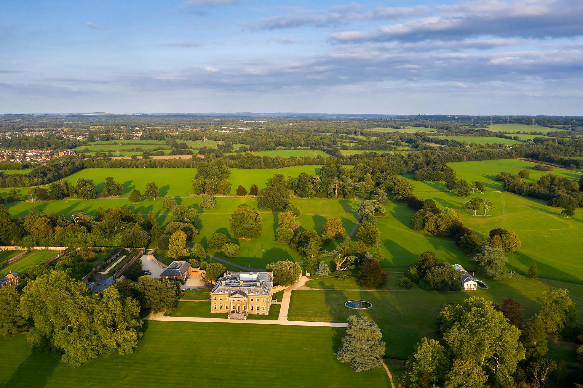 Broadlands Park estate with lush greenery, perfect for outdoor events and gatherings.