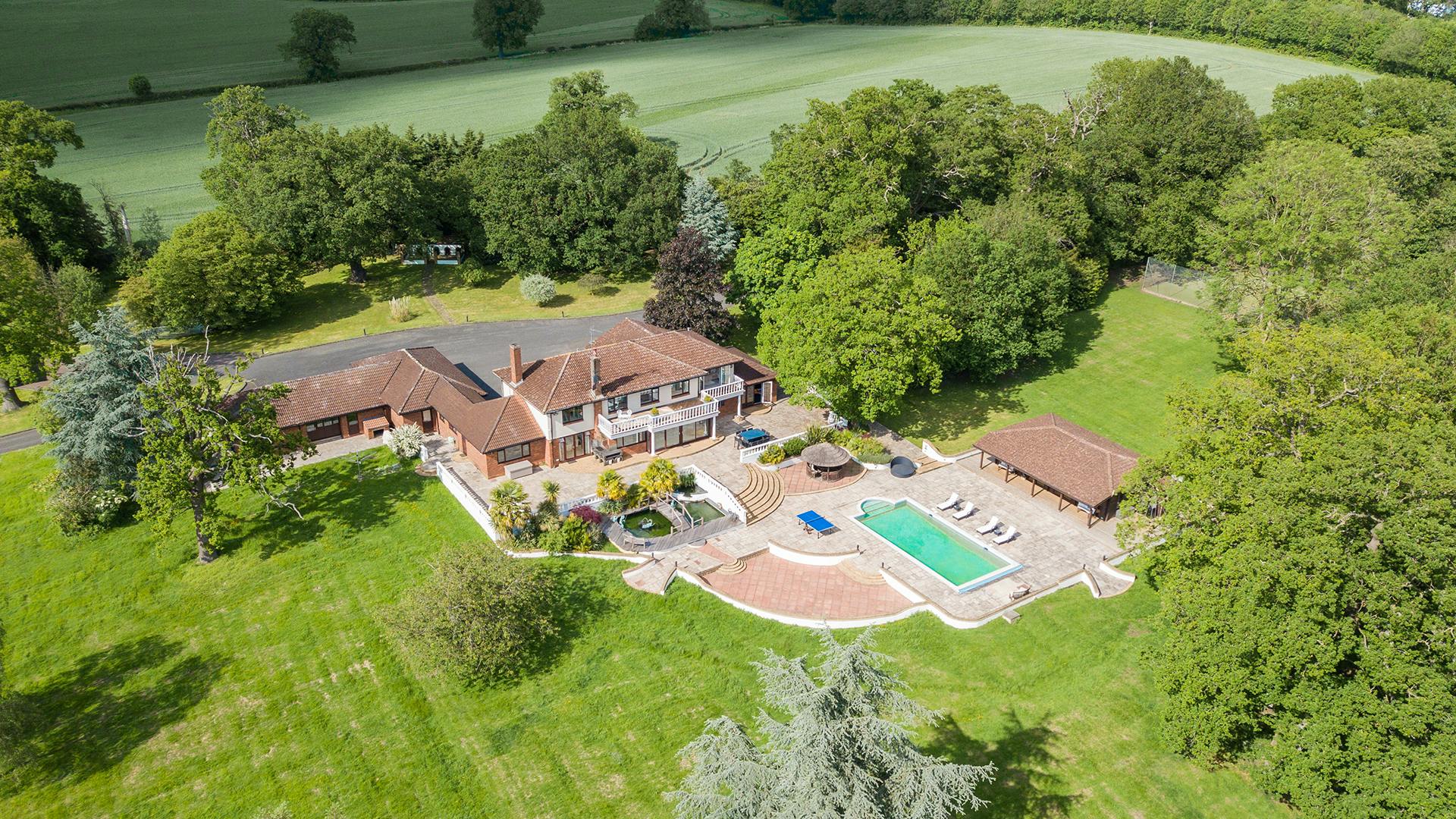 Villa Mansion outdoor venue with lush greenery for events and gatherings.